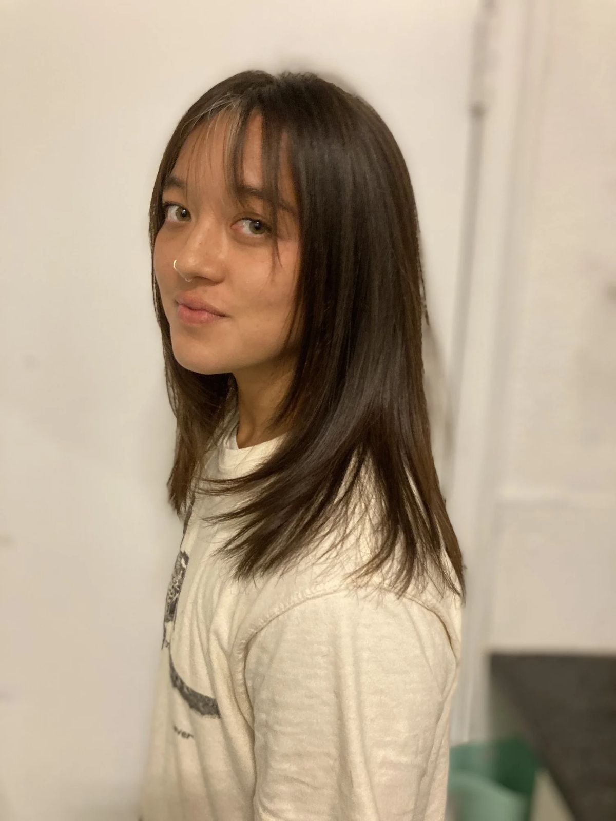 Medium dark hairstyle with bangs