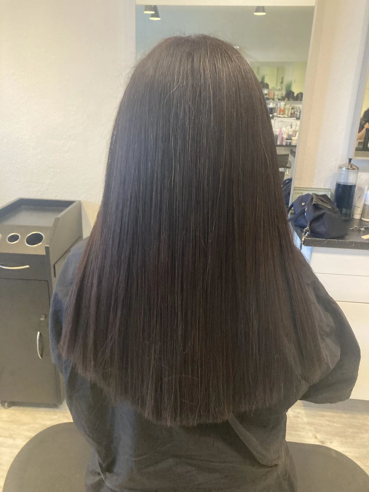 Long sleek dark brown blunt cut